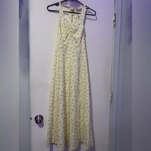 small yellow sundress covered in small flowers